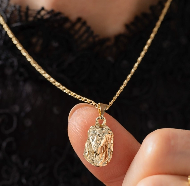 COLGANTE ROSTRO CRISTO MEDIANO ORO LAMINADO 18K - 1