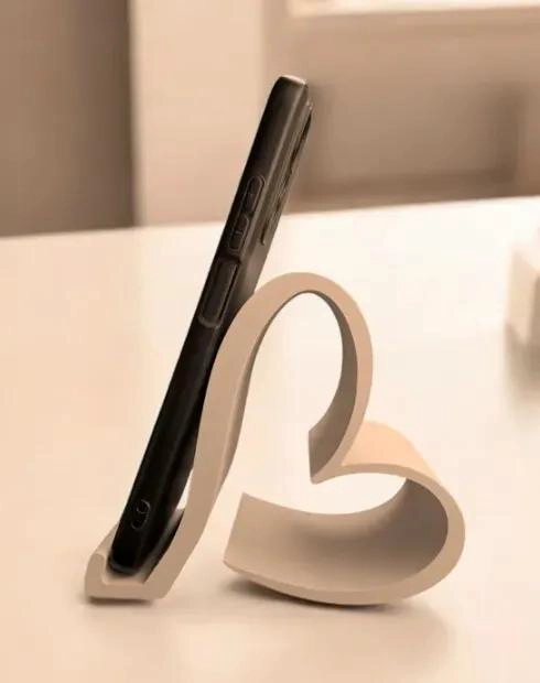 GENÉRICO SUJETA CELULAR CON DISEÑO DE CORAZON