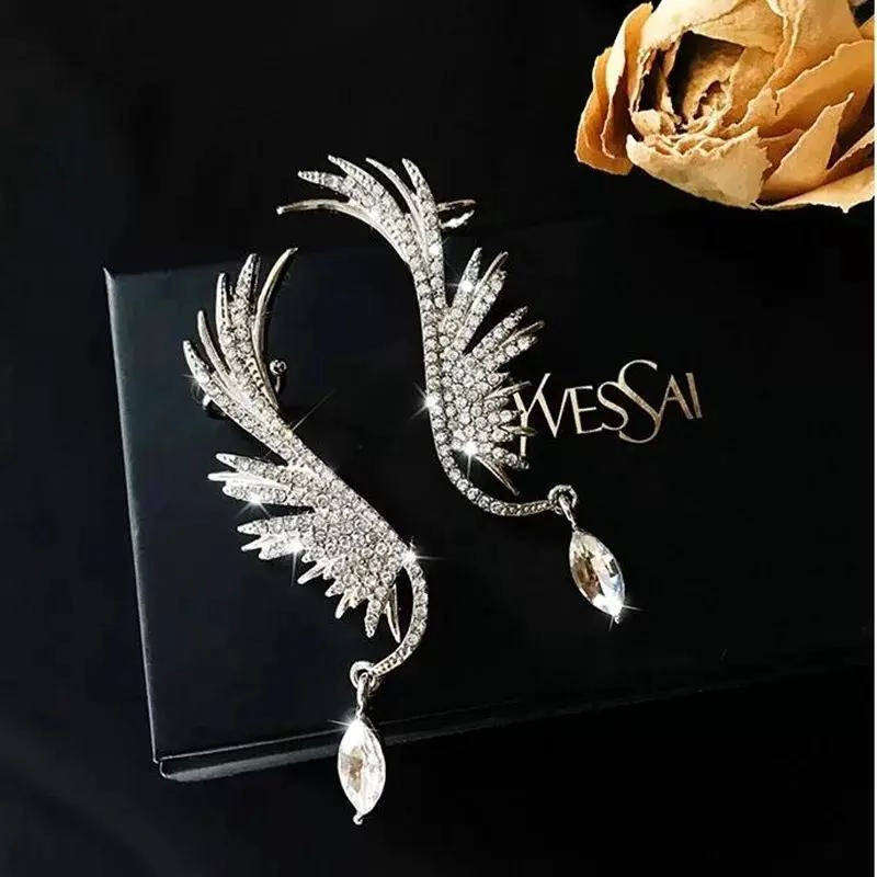 ARETES CON DISEÑO DE ALAS EN ACABADO PLATEADO ELEGANTE - 3
