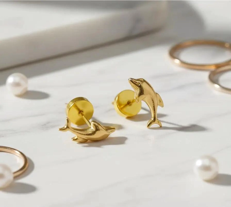 AROS DE ORO PARA BEBE  CON DISEÑO DE DELFINES - 1