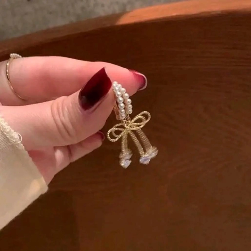 AROS ELEGANTES DE ACERO LAMINADO CON PERLAS Y LAZO - 2