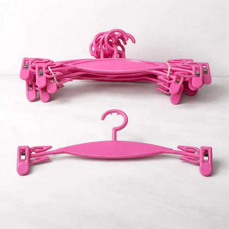PACK DE 30 COLGADORES ROSADOS CON PINZAS PARA ROPA INFANTIL - 1