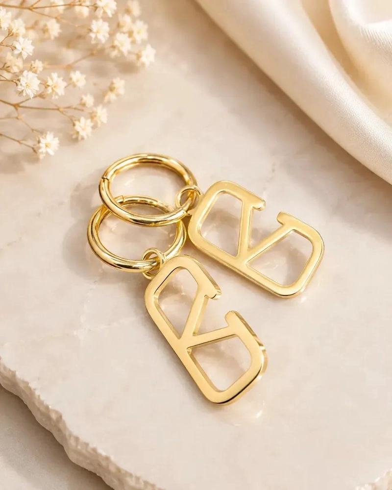 AROS DORADOS DE ACERO INOXIDABLE CON COLGANTE ELEGANTE - 1