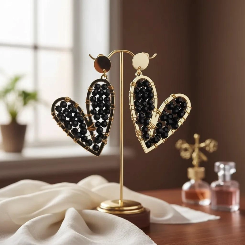 AROS LARGOS DE CORAZON CON PIEDRAS NEGRAS EN BAÑO DE ORO - 1