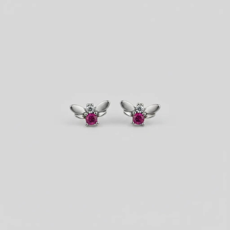 AROS DE MARIPOSA BAÑADOS EN ORO CON CRISTAL FUCSIA - 1