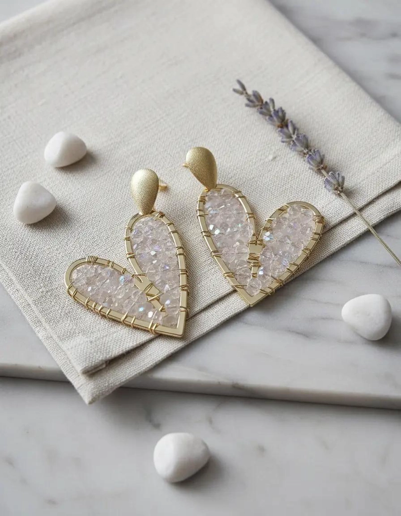 AROS MAXI CORAZONES CON PIEDRAS TRANSPARENTES EN BAÑO DE ORO - 1
