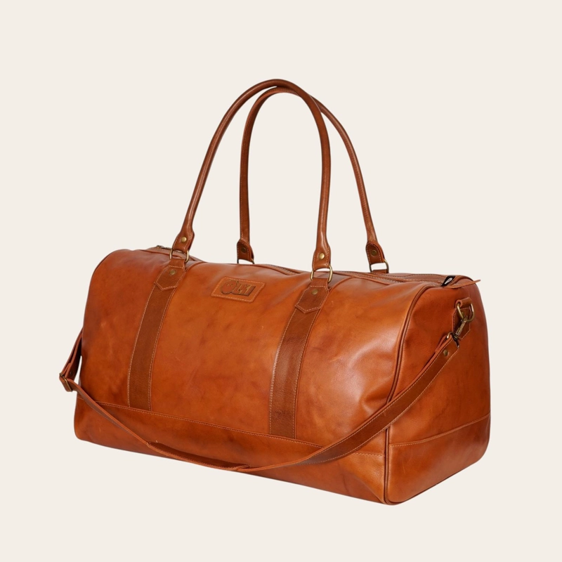 BOLSO DE VIAJE EN CUERO NATURAL FUTALEUFU OLKI - CURRY APLICACION - 1