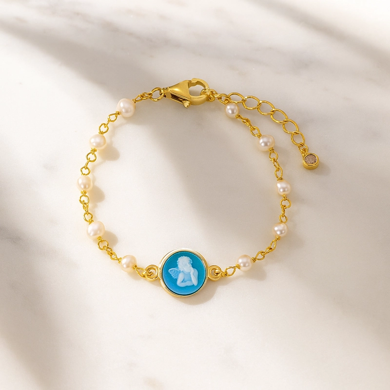 PULSERA  PERLITAS CON ANGEL AZUL. - 2