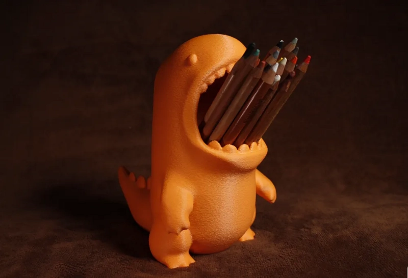 PORTALAPICES CON FORMA DE DINOSAURIO - 1