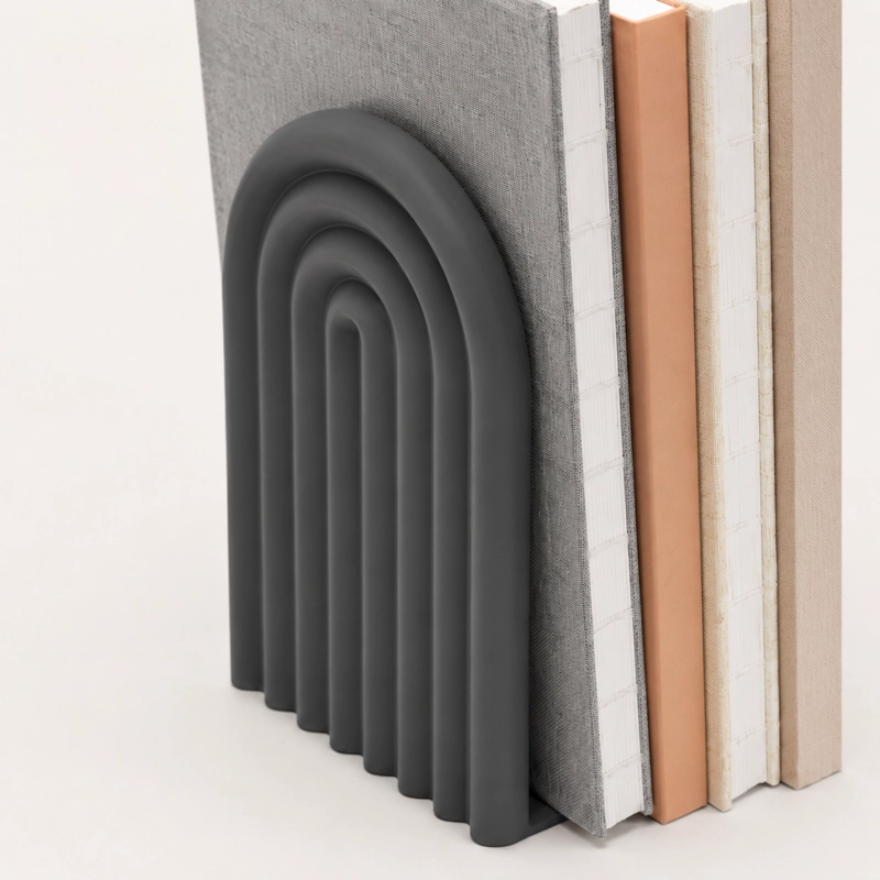 FIGURA DECORATIVA DE SUJETA LIBROS DE ARCO MODERNO - 2