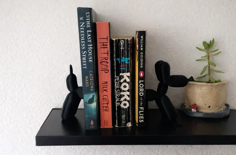 SUJETA LIBROS PERRO GLOBO - 2