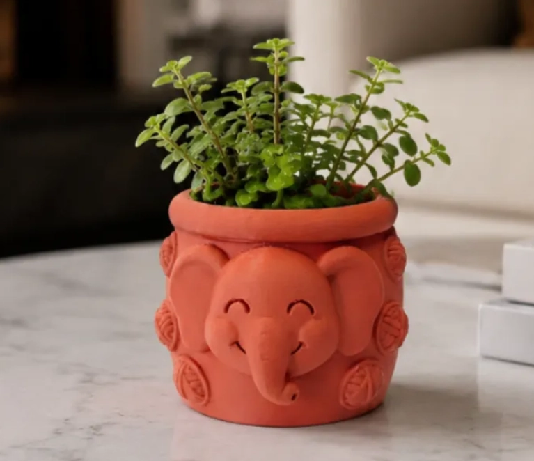 MACETERO DECORATIVO HOGAR- FORMA ELEFANTE TROMPITA 8 CM NARANJO - 1