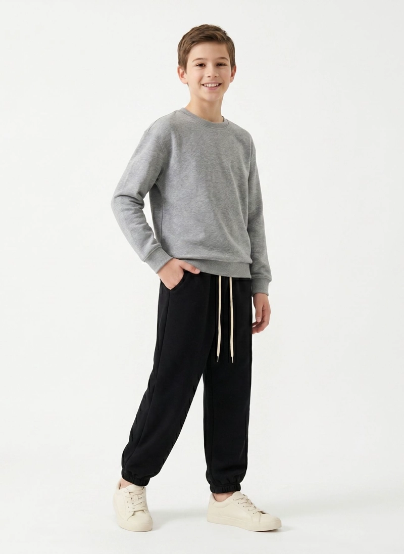 PANTALON BUZO NIÑO ALGODON JOGGER NEGRO CON PUÑO ESCOLAR - 1