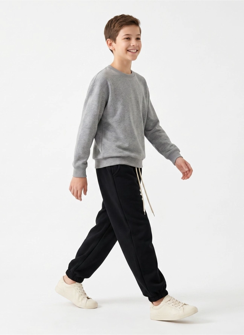 PANTALON BUZO NIÑO ALGODON JOGGER NEGRO CON PUÑO ESCOLAR - 2