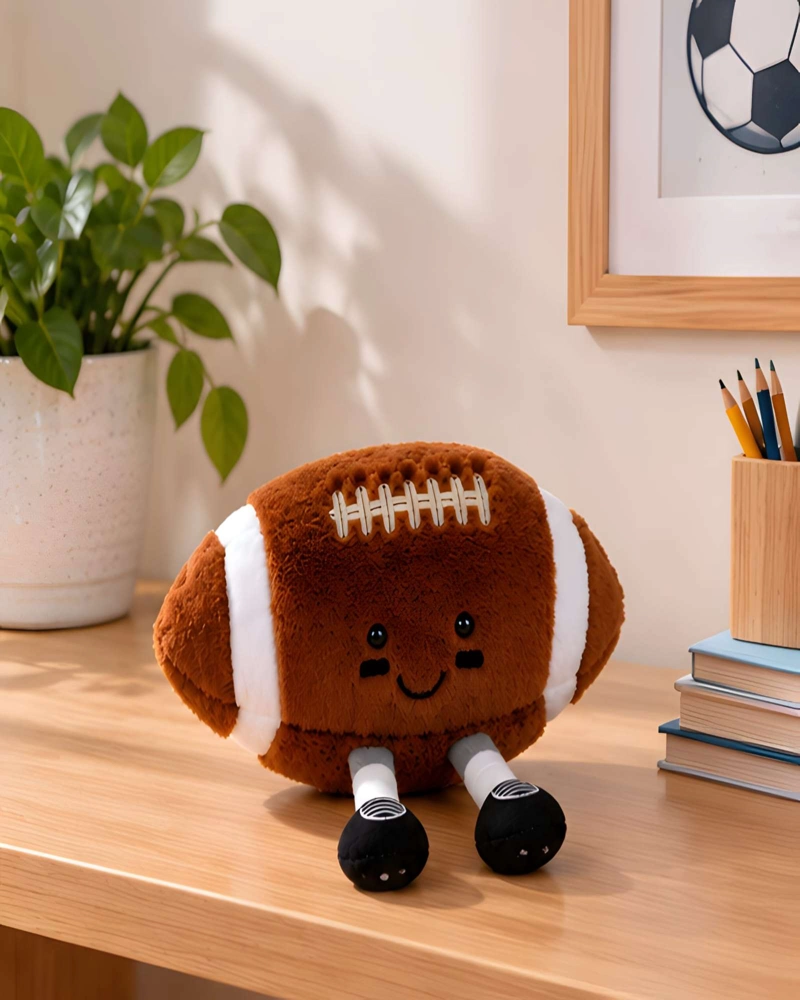 COJIN PELUCHE BALON FUTBOL AMERICANO CON PIERNAS PARA CUARTO INFANTIL - 2