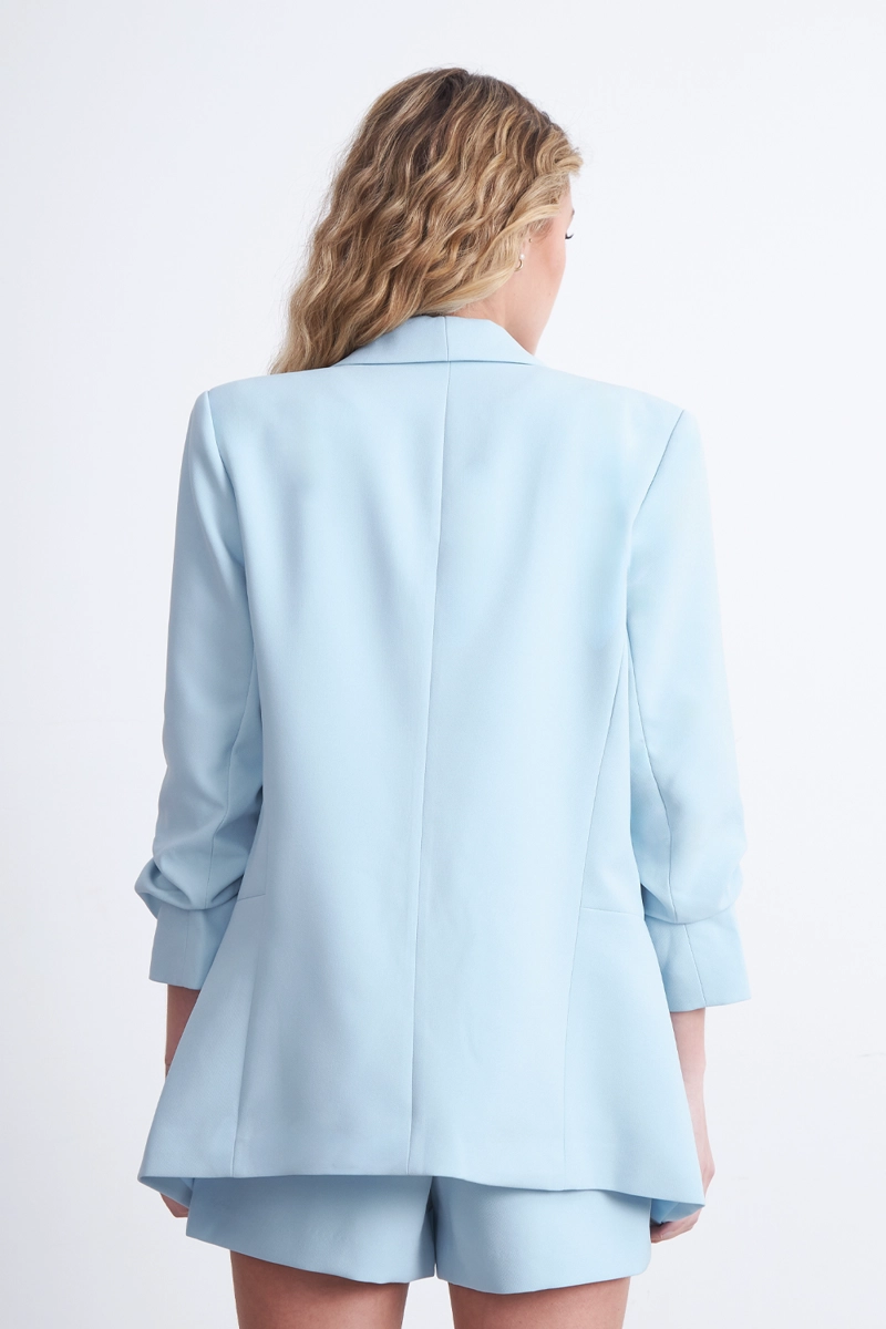 BLAZER MANGA 3/4 AJUSTADO CON SOLAPAS CELESTE MUJER NICOPOLY - 4