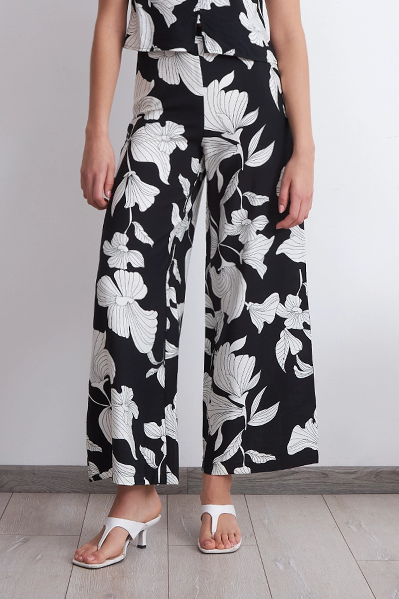 PANTALON NEGRO FLORES BLANCAS MUJER NICOPOLY S