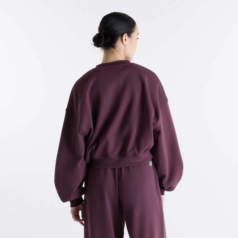 POLERON LIFESTYLE MUJER NEW BALANCE TRACKSID OVERSIZE MORADO - 1
