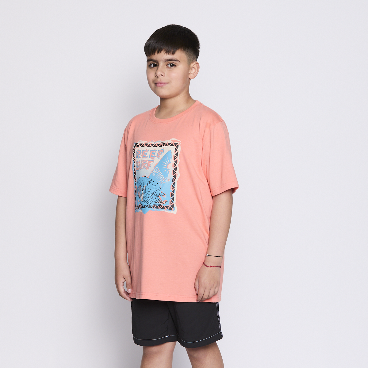 POLERA REEF KIDS ORANGE PRINT FRONT - 2