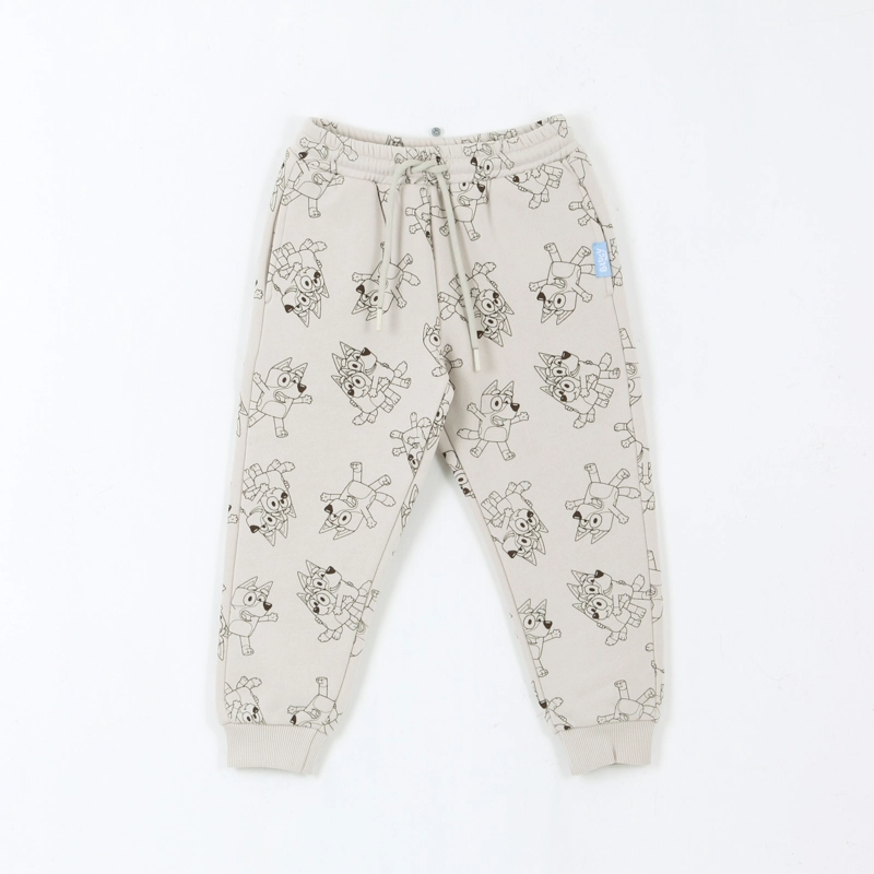 PANTALON DE BUZO NIÑO FULL PRINT LINEAL BEIGE BLUEY - 1