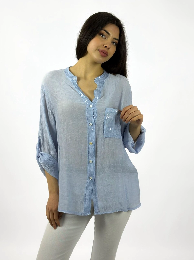 BLUSA CASUAL CON BRILLOS DORSO TEJIDO CELESTE - 2