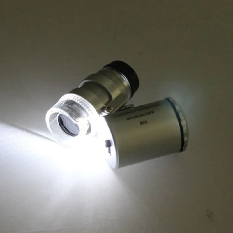 MICROSCOPIO LUPA BOLSILLO LUZ LED / UV 60X - 5