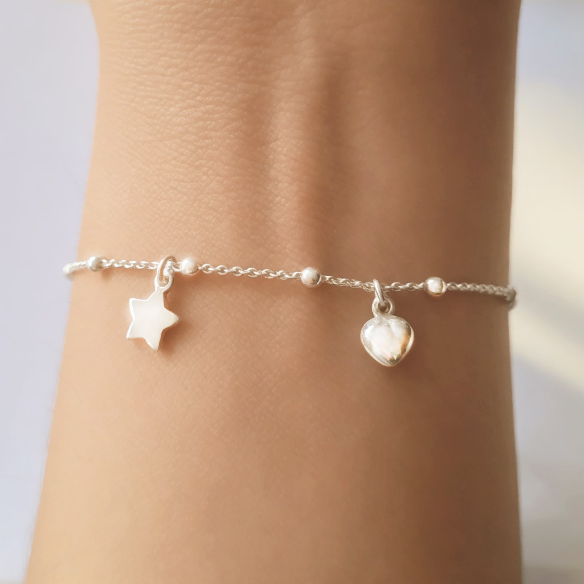 PULSERA ANDREA COGGIOLA JOYAS CHICHES CORAZÓN ESTRELLA BOLITA PLATA FINA 925 - 2