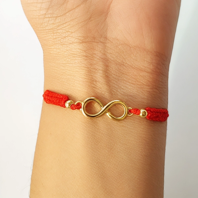 PULSERA ANDREA COGGIOLA JOYAS INFINITO BOLITAS ENCHAPADOS ORO 18K CORDÓN ROJO - 3