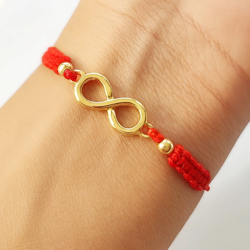 PULSERA ANDREA COGGIOLA JOYAS INFINITO BOLITAS ENCHAPADOS ORO 18K CORDÓN ROJO - 4