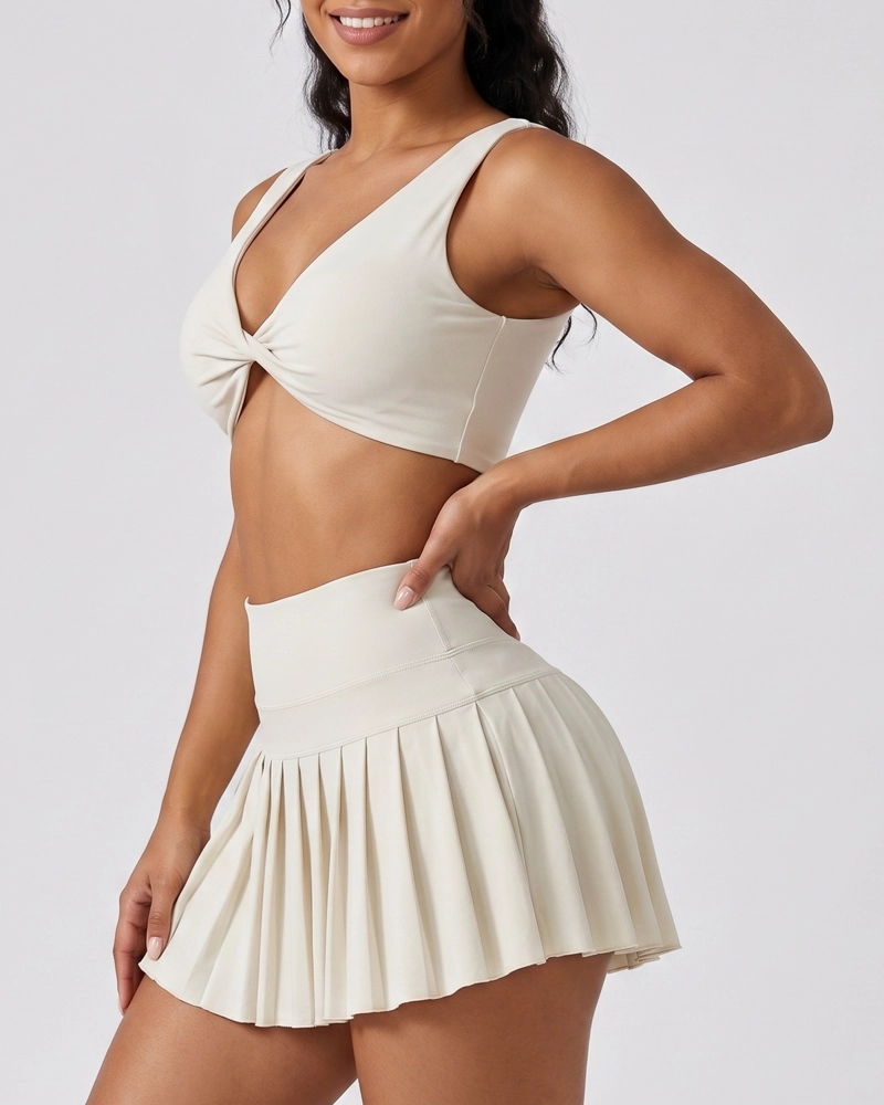 CONJUNTO FITNESS MUJER FALDA SHORT PLISADA Y TOP DEPORTIVO - 3