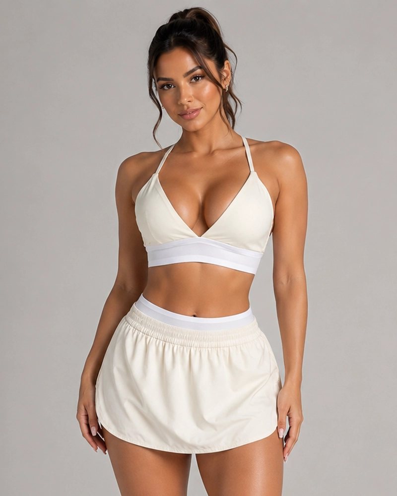 CONJUNTO DEPORTIVO 2 PIEZAS TOP Y FALDA SHORT CON CALZA INTERIOR - 1
