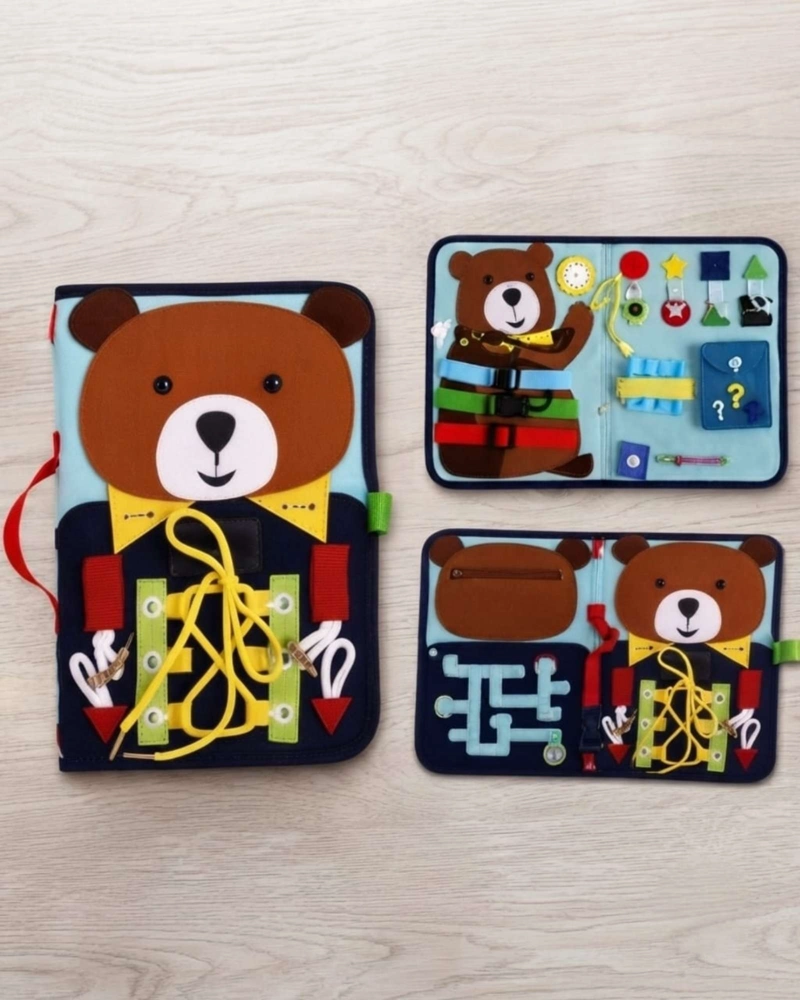 TABLERO DIDACTICO SENSORIAL MONTESSORI MALETA DE FIELTRO OSITO VIAJE. - 1
