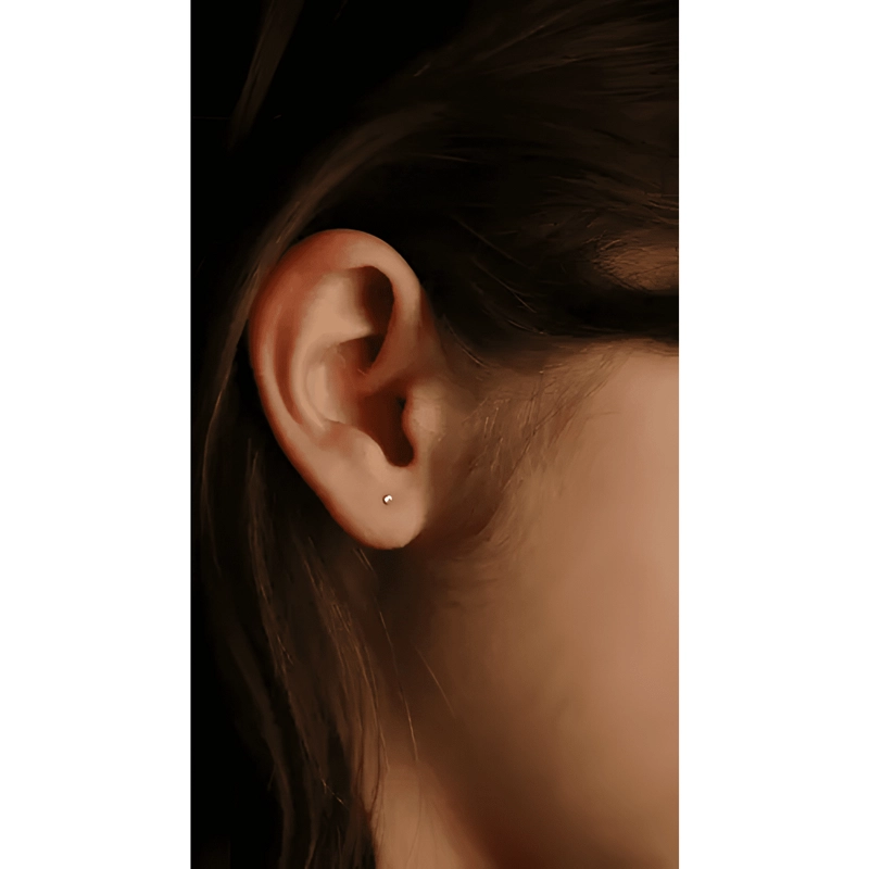 AROS PUNTO DE LUZ BEBE 20G TITANIO ASTM F136 G23 DORADOS - 1