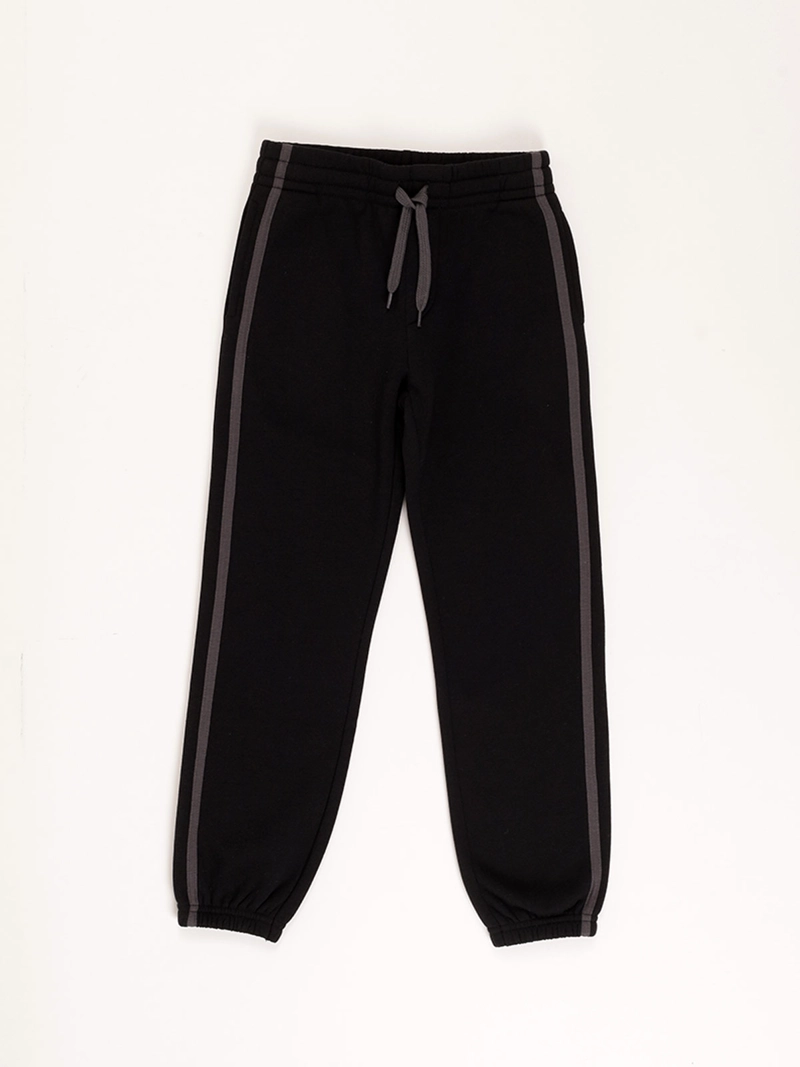 PANTALÓN DE BUZO NIÑO HARVEST LINEA LATERAL