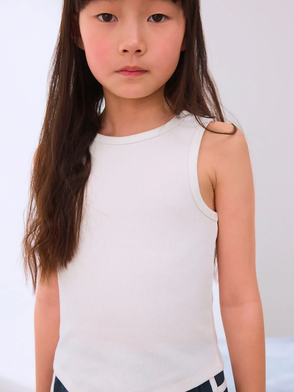 POLERA SIN MANGAS MANGA CORTA NIÑA NEXT - 1