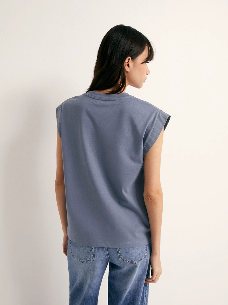 POLERA MUJER SFERA SIN MANGAS TACHAS - 2
